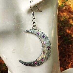 Crescent moon earring in glittery silver with light pink purple stars